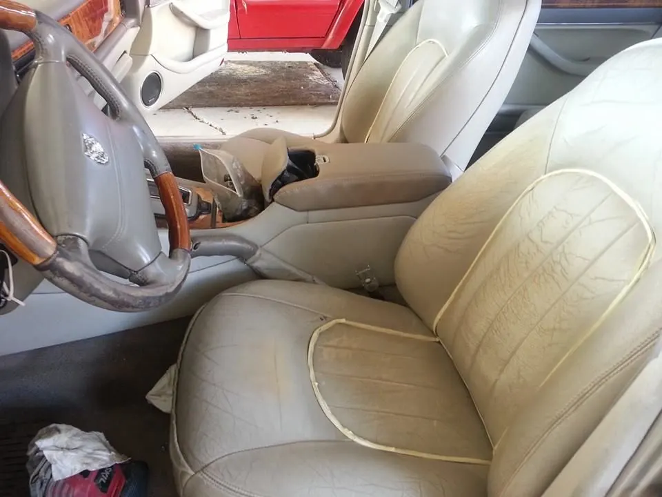 Worn driver seat before repair