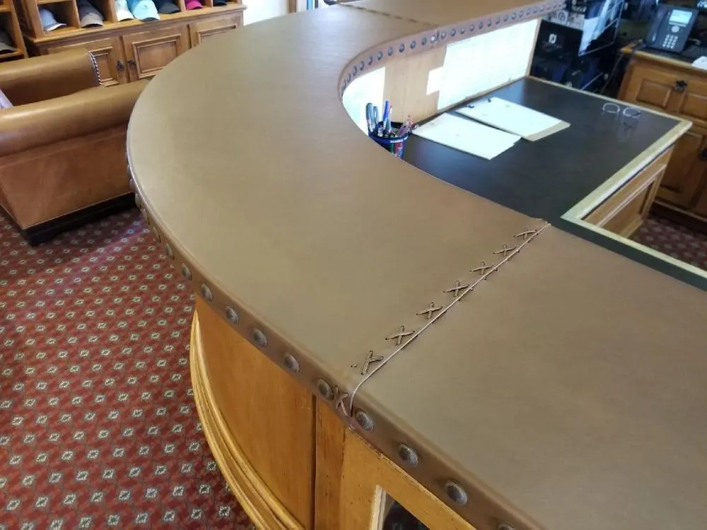 Commercial leather-front counter maintained by on-site repair