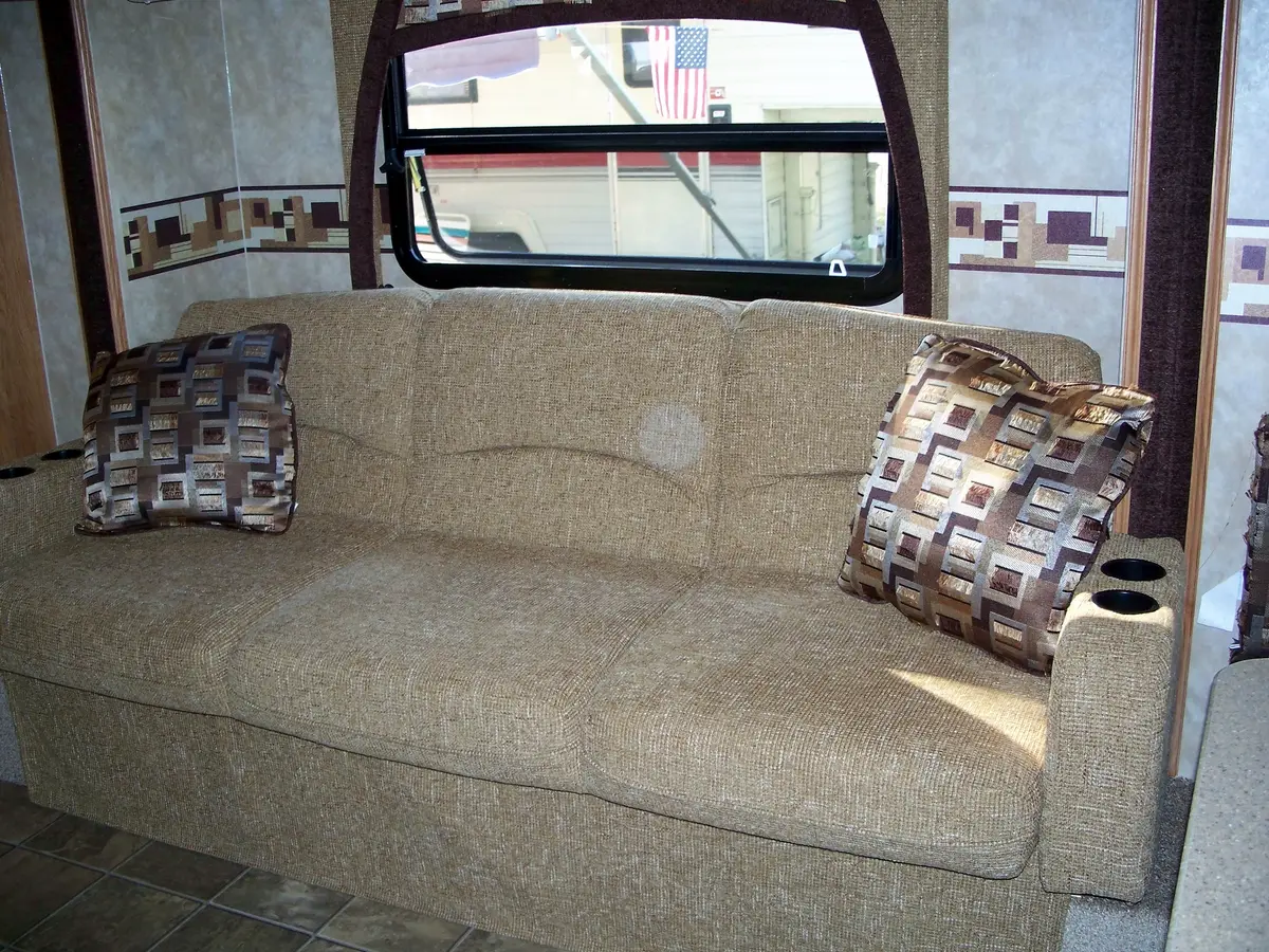 Travel trailer interior with sofa on a slide-out section